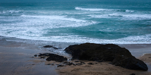 Fototapeta na wymiar Moody beach and waves