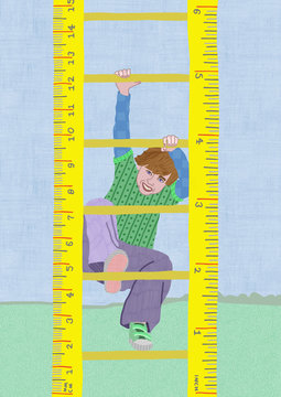 Boy climbing a ruler ladder 
