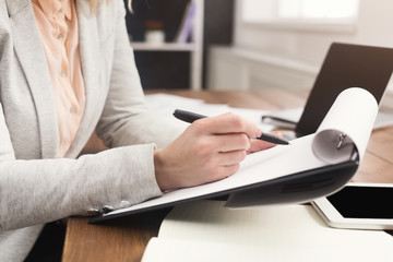 Close up of woman's hands with documents