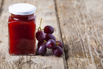 Jar of  jam and grapes