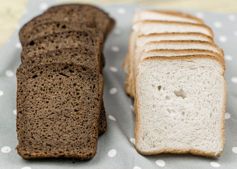 Sliced black and white bread.