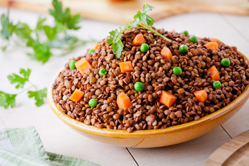 Bowl Of Organic Lentils With Carrot And Peas