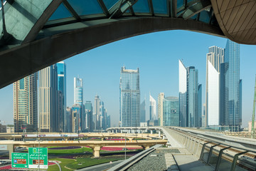 Obraz na płótnie Canvas Business buildings seen from the Dubai Mall train station 