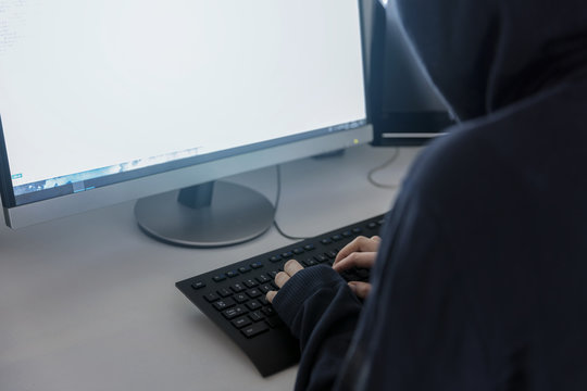 anonymous hacker in the hoodie, breaks the access to steal information and infect computers and systems. the concept of hacking and cyber war