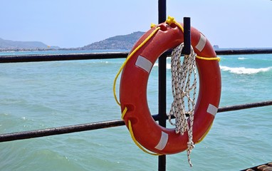 Lifebuoy close-up on a boat on the background of the sea.