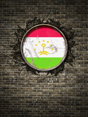 Old Tajikistan flag in brick wall