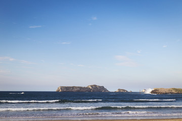 beautiful and rocky coastline under a blue sky for holidays

