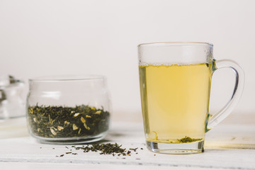 Mug of green tea and dry tea