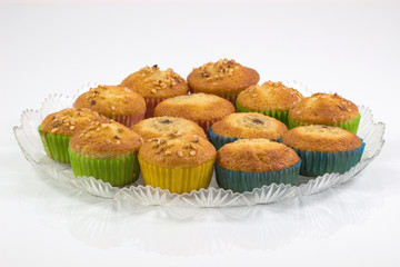 Homemade muffin cake tray, cupcake,banana cake with dried nuts Isolated on white background.