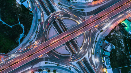 Expressway top view, Top view over the highway, expressway and motorway at night, Aerial view interchange of a city, Shot from drone, Expressway is an important infrastructure.