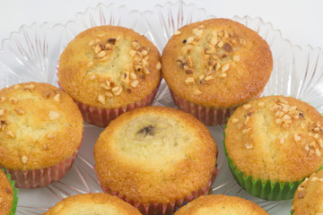 Fresh homemade delicious muffins,cupcake,banana cake with dried nuts isolated on white background.