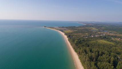 Aerial drone view of beautiful tropical island with sandy beach during sunny summer day