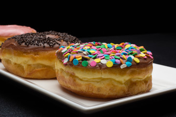 fresh donuts on a plate