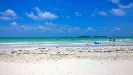 Ocean view of blue sky, beautiful clouds and pacific crystal turquoise water beside a tropical island with powdery white sand .  Cayo Guilermo , Cuba 