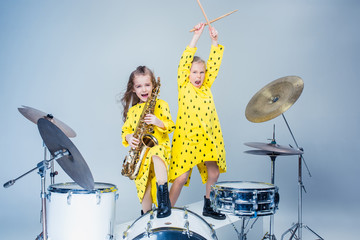 The teen music band performing in a recording studio