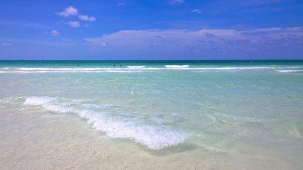 Ocean view of blue sky, beautiful clouds and pacific crystal turquoise water beside a tropical island with powdery white sand .  Cayo Guilermo , Cuba 