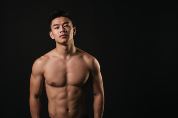 Fototapeta premium Portrait of young asian boy with fitness body.