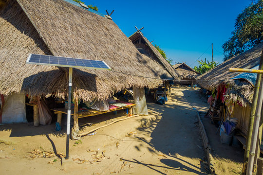 Outdoor view of solar pannel close to traditional houses of Long Neck trib, Kayan Lahwi, northern Thailand