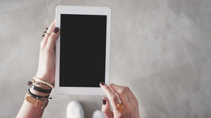 Woman hand holding empty blank tablet 