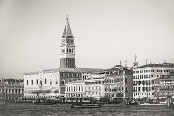 Bell tower of St Mark's Square and Doge's Palace Venice Italy with barges black and white, Symbol of Venice