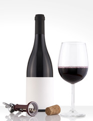 Isolated Red Wine Bottle in a White Background, White Label Label and Glass