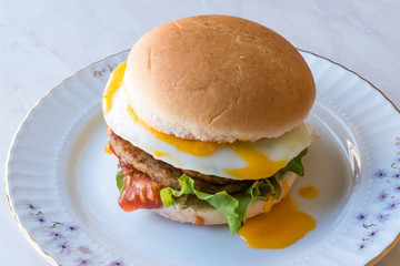 Homemade Double Hamburger with Egg, Lettuce and Tomatoes.