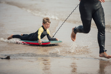 Naklejka premium Little Boy Bodyboarding