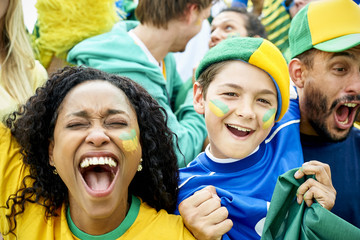 Brazilian football fans watching football match