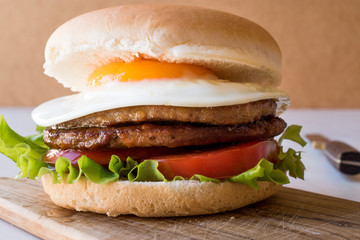 Homemade Double Hamburger with Egg, Lettuce and Tomatoes.