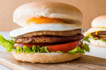 Homemade Double Hamburger with Egg, Lettuce and Tomatoes.
