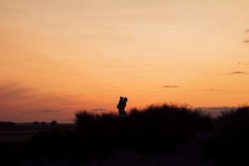 Silhouette of Woman Giving a Piggyback