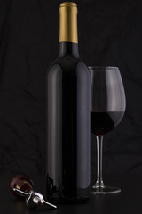 Isolated Red Wine Bottle in a Black Background