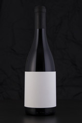 Isolated Red Wine Bottle in a Black Background