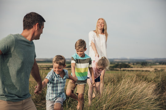 Family Walks Through the Sand Dunes