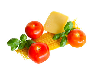 Raw spaghetti pasta with fresh tomatoes, green basil and parmesan cheese isolated on white background