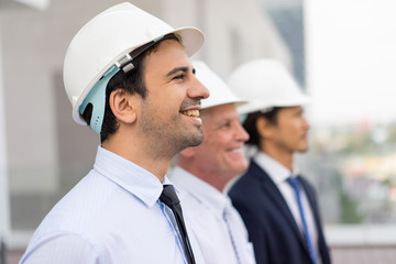 Young Architect and Coworkers at Construction Site