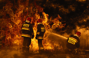 firefighters extinguishing a dangerous fire