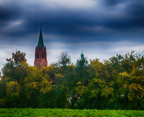 Cathedral in cloudy weather amid nature