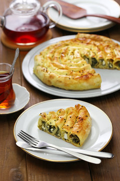 homemade kol borek, turkish rounded pie, spinach and feta cheese