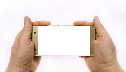 Smartphone in hand, man's hand holds a glass mobile phone of gold color on a white background.