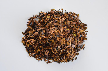 Herbs of toasted Erva-mate. Erva-mate is used to prepare a hot or cold tea drink, the Cha-Mate tea.
