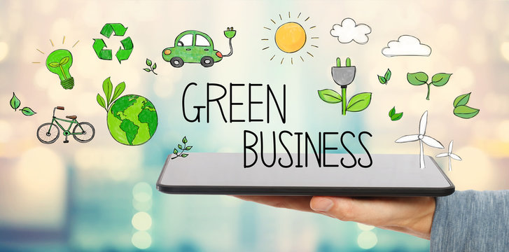 Green Business with man holding a tablet computer