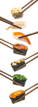 Sushi pieces placed between chopsticks, separated on white background. Popular sushi food.