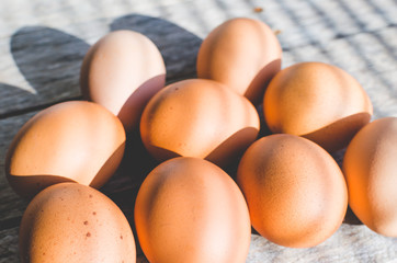 Chicken eggs are dried on old wooden boards.