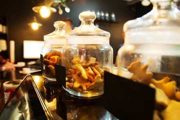 Fototapeta na wymiar Ginger cookies in jars on the bar