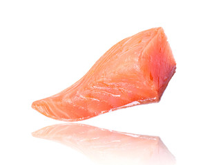 Juicy slice of salmon close-up on white background