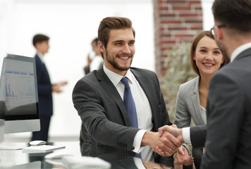 happy man introducing businesswoman to business partners