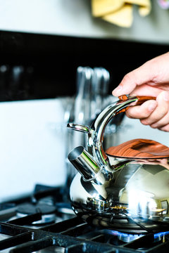 Tea Kettle With Boiling Water On Gas Stove