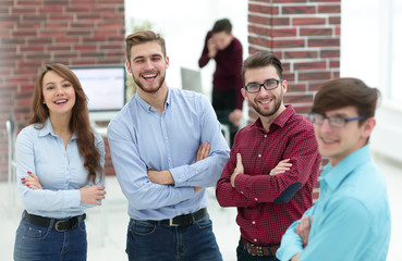 Happy smiling business team in office.
