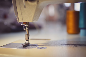Close up of a sewing machine with blurred background and low DOF